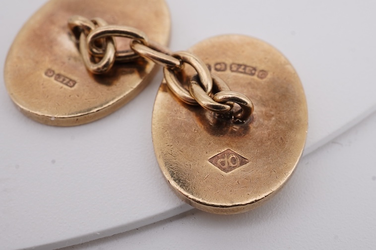 A pair of early to mid 20th century Austro Hungarian yellow metal and two colour enamel set oval cufflinks and a pair of 1930's engine turned 9ct gold oval cufflinks, gross weight 22 grams. Condition - fair